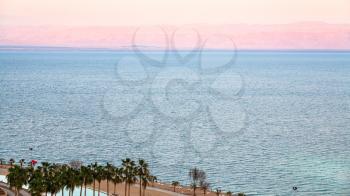 Travel to Middle East country Kingdom of Jordan - pink dawn over Dead Sea in winter morning