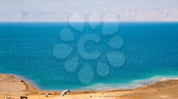 Travel to Middle East country Kingdom of Jordan - above view of beach of Dead Sea in sunny winter day