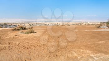 Travel to Middle East country Kingdom of Jordan - desert area of Wadi Al Kharrar (Tell Al-Kharrar, Elijah Hill) near Baptism Site Bethany Beyond the Jordan (Al-Maghtas) in sunny winter day