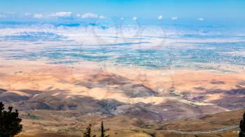 Travel to Middle East country Kingdom of Jordan - above view of hills in Holy Land from Mount Nebo in winter
