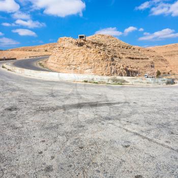 Travel to Middle East country Kingdom of Jordan - turn on mountain road King's highway near Al Mujib dam in winter