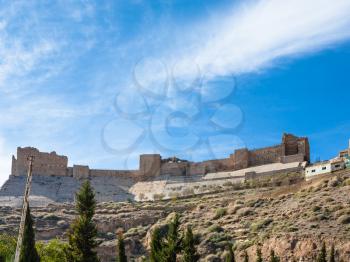 Travel to Middle East country Kingdom of Jordan - blue sky over Kerak Castle in sunny winter day