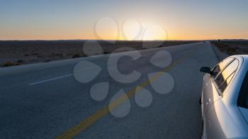 Travel to Middle East country Kingdom of Jordan - sundown and Desert Highway (Road 15) in Jordan in winter