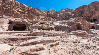 Travel to Middle East country Kingdom of Jordan - stone cave tombs in Petra town