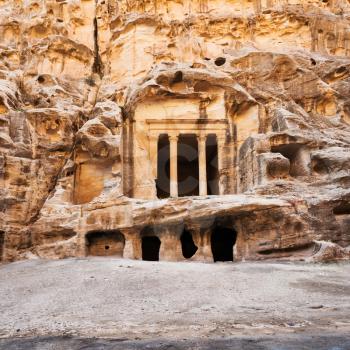 Travel to Middle East country Kingdom of Jordan - front view of ancient Nabatean Temple in Little Petra town (Siq al-Barid station) in winter
