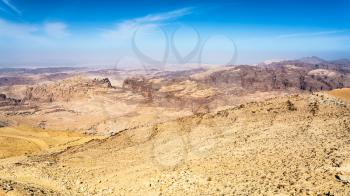 Travel to Middle East country Kingdom of Jordan - view of sedimentary rocks around Wadi Araba (Arabah, Arava, Aravah) region near Petra town in sunny winter day