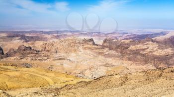 Travel to Middle East country Kingdom of Jordan - view of sedimentary mountains around Wadi Araba (Arabah, Arava, Aravah) region near Petra town in sunny winter day