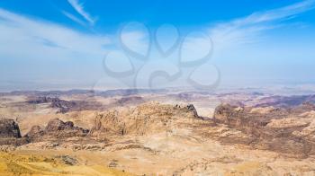 Travel to Middle East country Kingdom of Jordan - view of sedimentary rocks around Wadi Araba (Arabah, Arava, Aravah) area near Petra town in sunny winter day