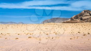 Travel to Middle East country Kingdom of Jordan - landscape of Wadi Rum desert in sunny winter day