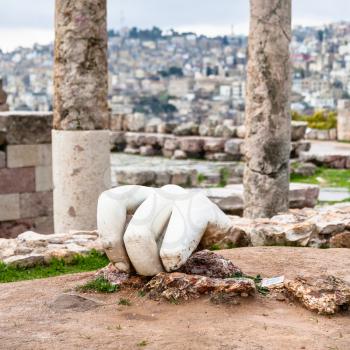AMMAN, JORDAN - FEBRUARY 18, 2012: Hand of Hercules in Temple of Hercules at Amman Citadel in winter. The Temple was built in roman period 162-166 AD, when the city was known as Philadelphia