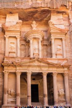 PETRA, JORDAN - FEBRUARY 21, 2012: ffront view of facade of al-Khazneh temple (The Treasury) in Petra town. Rock-cut town Petra was established about 312 BC as the capital city of the Arab Nabataean