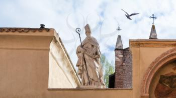 travel to Italy - sculpture of Saint on walls of Church of San Zeno in Oratorio (Chiesa di San Zenetto) in Verona city in spring