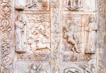 travel to Italy - medieval outdoor ornament on gate of Basilica di San Zeno ( San Zeno Maggiore, San Zenone) in Verona city