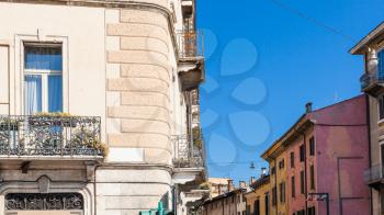 travel to Italy - apartment houses on street Lungadige Sammicheli in Verona city in spring