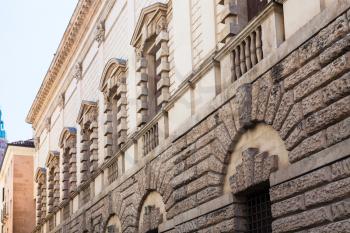 travel to Italy - wall of palazzo Thiene on street Contra Giacomo Zanella in Vicenza city in spring. Palazzo Thiene is a 15th-16th-century palace designed for Marcantonio and Adriano Thiene