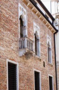 travel to Italy - wall of medieval palazzo thiene on street contra porti in Vicenza city in spring.