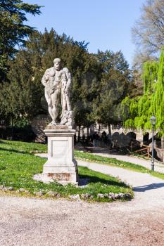 travel to Italy - replica of statue of Heracles (dd 1921 by Ercole Farnese) in urban public park Giardini Salvi (Garden of Valmarana Salvi)
