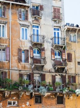 travel to Italy - facade of old urban house in Verona city on Piazza delle Erbe in spring