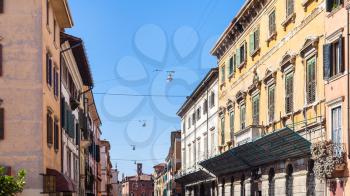 travel to Italy - apartment houses on street Stradone San Fermo in Verona city in spring