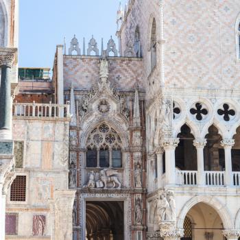 travel to Italy - decorated portal of Doge's palace on Piazza San Marco in Venice city in spring day
