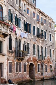 travel to Italy - living house on waterfront of Rio de la Pieta canal in Venice city in spring
