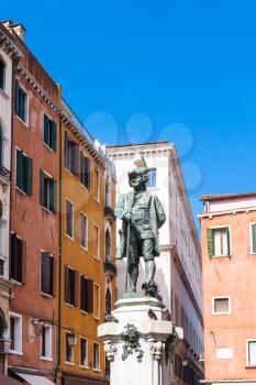 travel to Italy - bronze sculpture of Carlo Goldoni on Campo San Bartolomeo in Venice city in spring