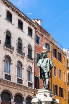 travel to Italy - bronze statue of Carlo Goldoni on Campo San Bartolomeo in Venice city in spring