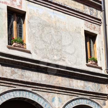 travel to Italy - facade of medieval house on piazza guglielmo marconi in Mantua city in spring