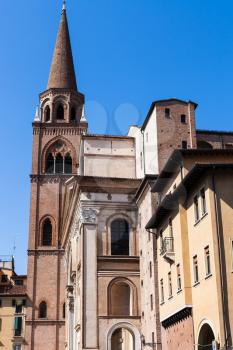 travel to Italy - bell tower of Basilica of Sant'Andrea and urban houses in Mantua city in spring