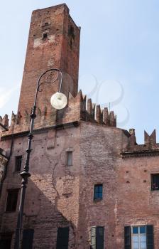 travel to Italy - view of Torre della Gabbia from piazza Sordello in Mantua city in spring