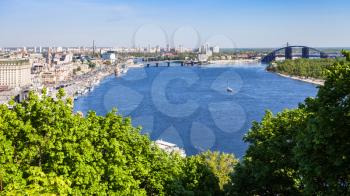 travel to Ukraine - above view of Kiev city with River Port and Dnieper River from Volodymyrska Hill (Saint Volodymyr Hill) in spring