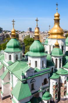 travel to Ukraine - above view of edifice of Saint Sophia (Holy Sophia, Hagia Sophia) Cathedral from bell tower in Kiev city in spring