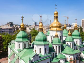 travel to Ukraine - domes of Saint Sophia (Holy Sophia, Hagia Sophia) Cathedral and Kiev city from bell tower in spring