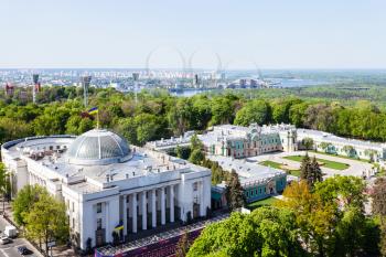 KIEV, UKRAINE - MAY 4, 2017: above view of Verkhovna Rada building (Supreme Council of Ukraine) on Hrushevsky street and Mariyinsky palace in Mariinsky park and Dnieper River on horizon in spring