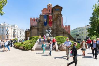 KIEV, UKRAINE - MAY 5, 2017: tourists near Golden Gate Monument (Golden Gates of Kiev) in Kyiv city. The Golden Gates were built in 1017-1024, the modern gates was completely rebuilt by in 1982