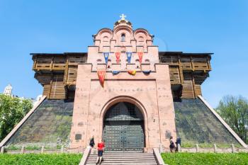 KIEV, UKRAINE - MAY 5, 2017: tourists near doors of Golden Gate Monument (Golden Gates of Kiev) in Kyiv. The Golden Gates were built in 1017-1024, the modern gates was completely rebuilt by in 1982