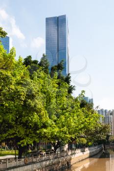 Travel to China - high-rise houses and park on quay in Zhujiang New Town of Guangzhou city in spring