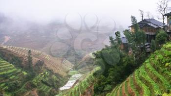travel to China - view of terraced fields of Tiantouzhai village in area Dazhai Longsheng Rice Terraces (Dragon's Backbone terrace, Longji Rice Terraces) country in spring