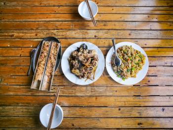 travel to China - top view of served local chinese dinner in rustic eatery in area Dazhai Longsheng Rice Terraces (Dragon's Backbone terrace, Longji Rice Terraces) country in spring