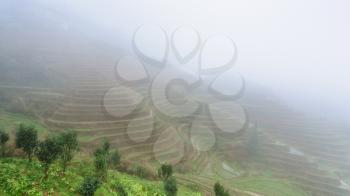 travel to China - view of rice terraced fields in brume from viewpoint Music from Paradise in area of Dazhai Longsheng Rice Terraces (Dragon's Backbone terrace, Longji Rice Terraces) country in spring