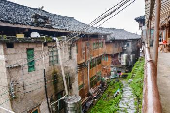 travel to China - houses in Tiantouzhai village in rainy spring day in area Dazhai Longsheng Rice Terraces (Dragon's Backbone terrace, Longji Rice Terraces) country