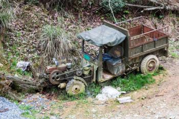 travel to China - old broken truck on side of country road in in area Dazhai Longsheng Rice Terraces ( Longji Rice Terraces)