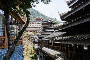 travel to China - apartments and Dong people style bridge in Longsheng Hot Springs National Forest Park in Jiangdi village of Xiangshan District in spring season