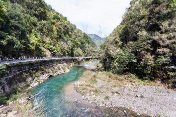 travel to China - road along river to Longsheng Hot Springs in National Forest Park in Jiangdi village of Xiangshan District in spring season