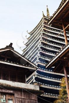 travel to China - wooden house and pagoda in Chengyang village in rain of Sanjiang Dong Autonomous County in spring