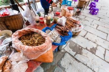 travel to China - snacks on local market in Chengyang village of Sanjiang Dong Autonomous County in spring season