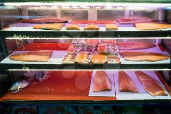 Travel to China - Smoked salmon fillet in window on Huangsha Aquatic Product Trading Market in Guangzhou city in spring season.