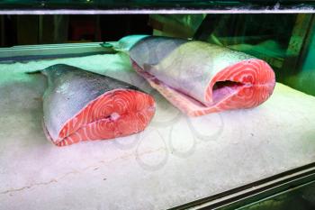 Travel to China - pieces of salmon fish on ice in Huangsha Aquatic Product Trading Market in Guangzhou city
