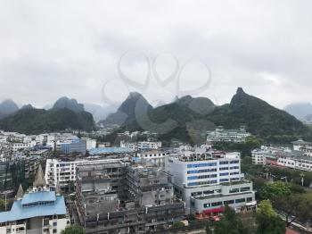 travel to China - above view of Guilin city and green mountains in spring season