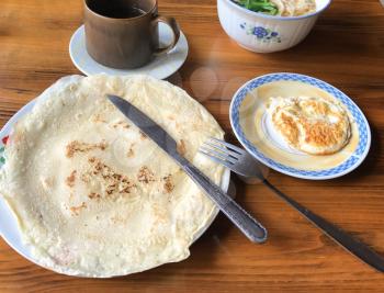 travel to China - pancake and omelette in chinese cafe in in Chengyang village of Sanjiang Dong Autonomous County